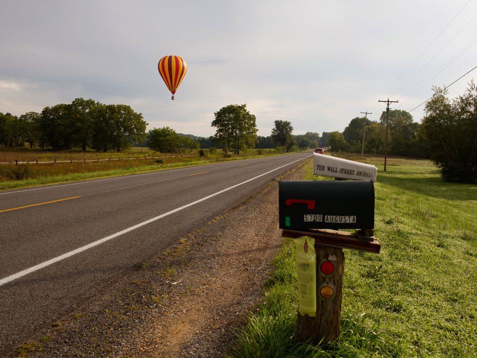 A hot air balloon prepares to land in rural Michigan near Battle Creek. New research shows that colleges seldom recruit from high schools in sparsely populated rural areas.