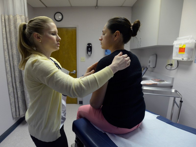 In this 2013 photo, Shannan Van Houten, a physician assistant, gives medical care to a patient at Golden Valley Health Center, CareNow, in Modesto, California. Physician assistant is a fast-growing and well-paid profession that is expected to add an estimated 39,700 jobs over the next decade.