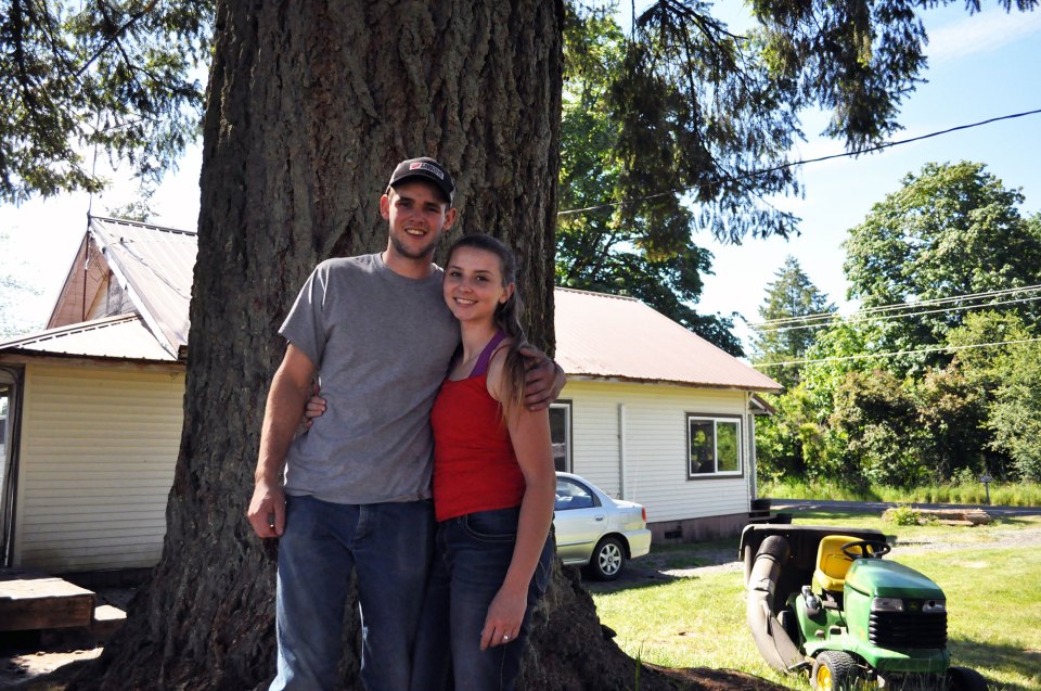 Hunter Blair and his fiancée, Ronnie Kinsman, pose in the field behind their home on June 2, 2018, in Onalaska, Washington. The pair graduated from Onalaska High School in 2017 and 2016 respectively, and say they intend to settle down in their hometown. “It’s beautiful country up here,” Kinsman said. “Why leave something that we love?”