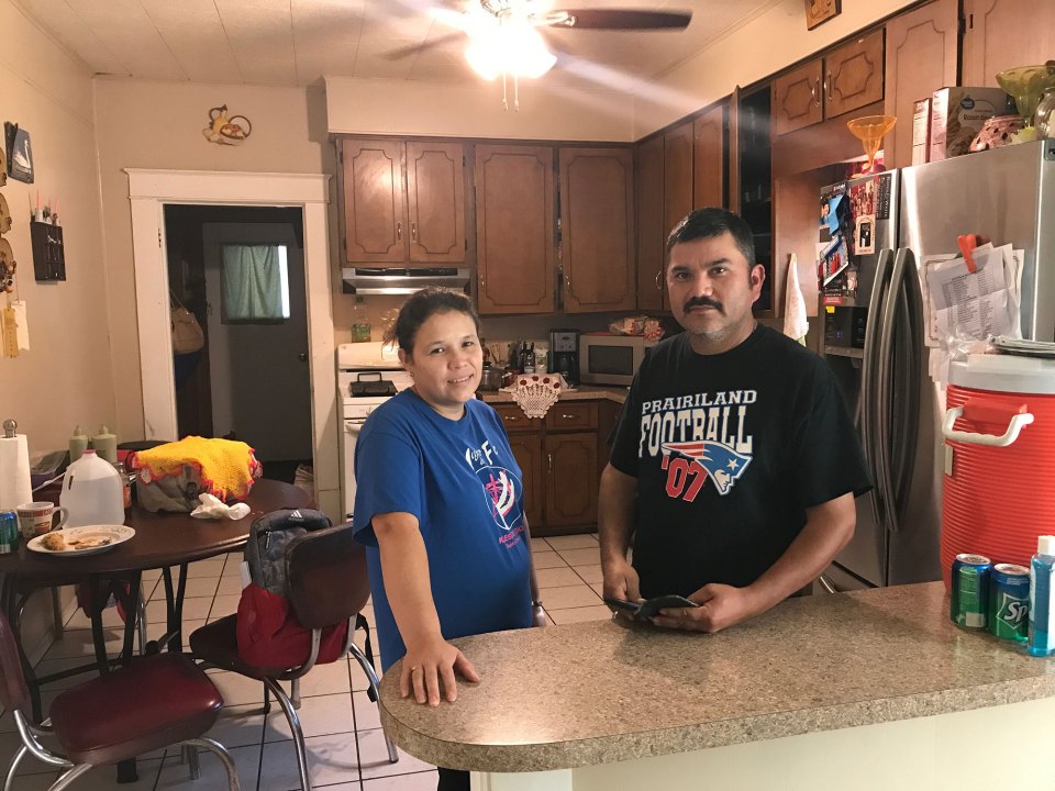 Oralia Rubio, left, and her husband, Hermenegildo, stand in the kitchen of their home in Honey Grove, Texas. Hermenegildo was one of 159 workers arrested at the Load Trail trailer plant in nearby Sumner on August 28, 2018. He now faces possible deportation.