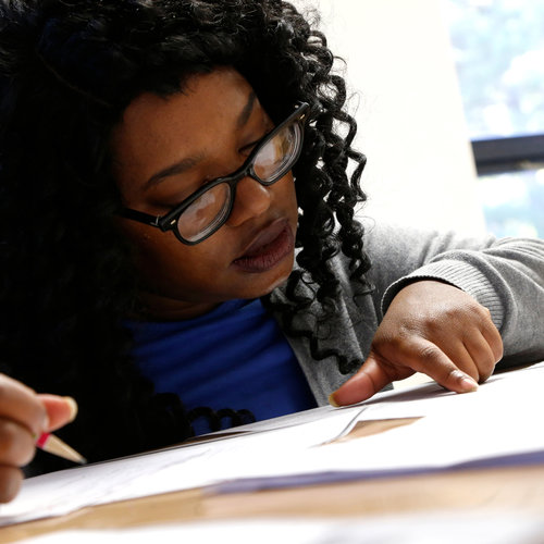 Kenyatta Burn works with her tutor at the Durham Literacy Center on Thursday, Nov. 20, 2017, in Durham, N.C.