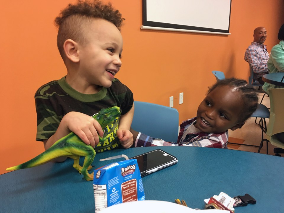 Dominic, 3 and Zaire, 2, play while their moms take part in a conversation about bullying at a Family Scholar House Café Night.