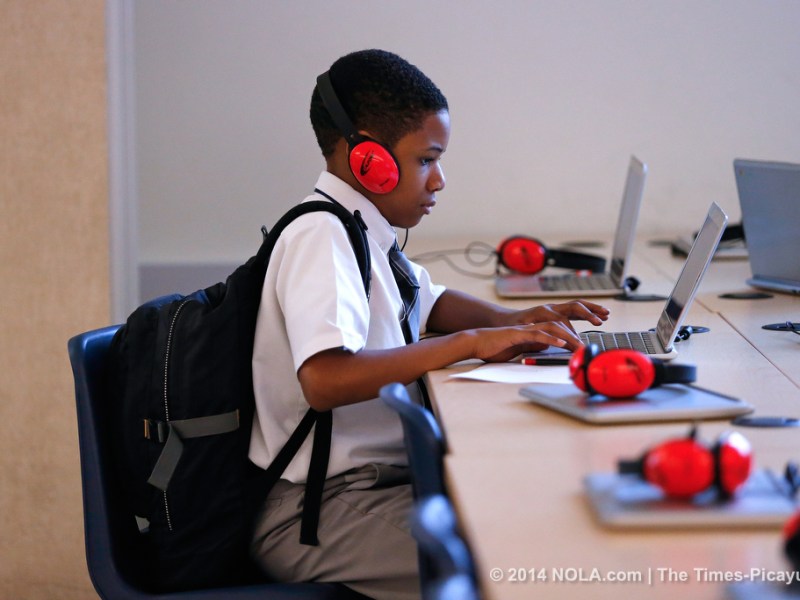 Giann Nelson plays the "i-Ready" game with his back pack on - he likes to wear it for back support- at the Arthur Ashe Charter School on Friday, April 25, 2014. Arthur Ashe's "blended learning" program is nationally praised, with classes that include both computerized and personal instruction. (Photo by Julia Kumari Drapkin, Nola.com | The Times-Picayune) No reproduction