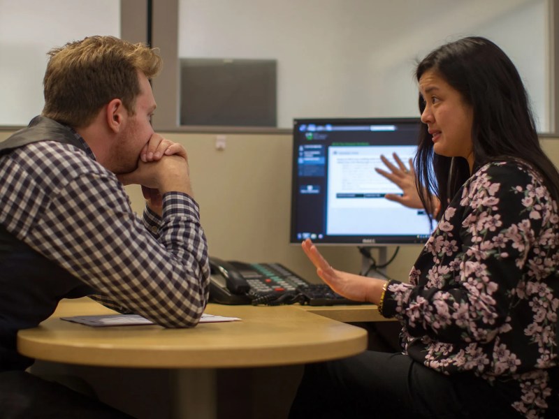 Client Paul Chirico of Los Angeles works with tax preparer Erika Arbulante to see how the Affordable Care Act, ACA, will impact his tax returns at H&R Block on January 8, 2015 in Los Angeles, California.